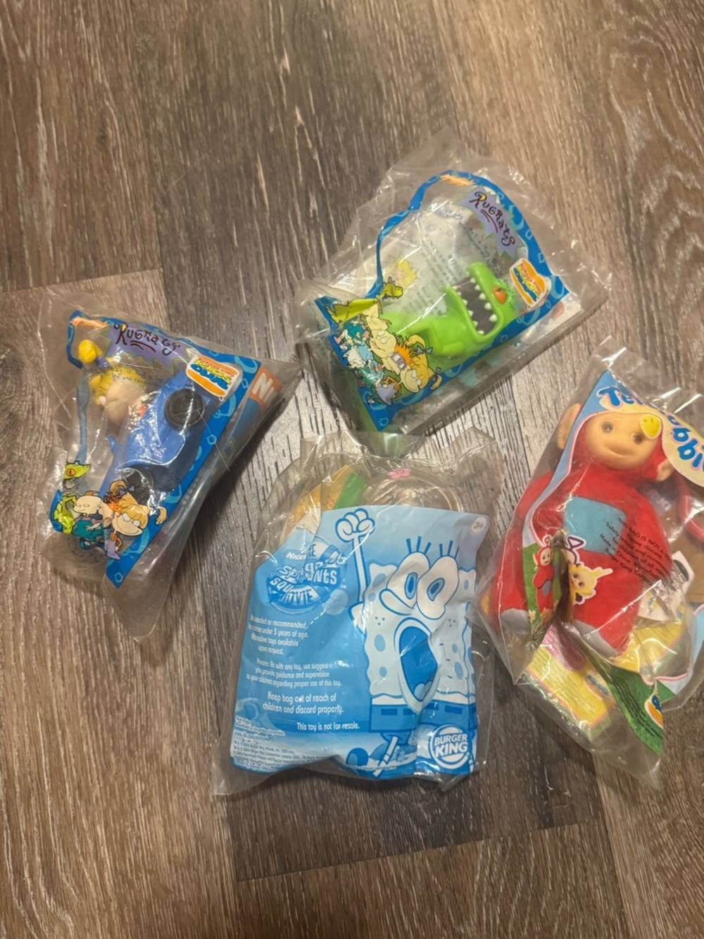 4 Assorted Character Figures from Burger King Teletubbies Rugrats Sandy Cheeks